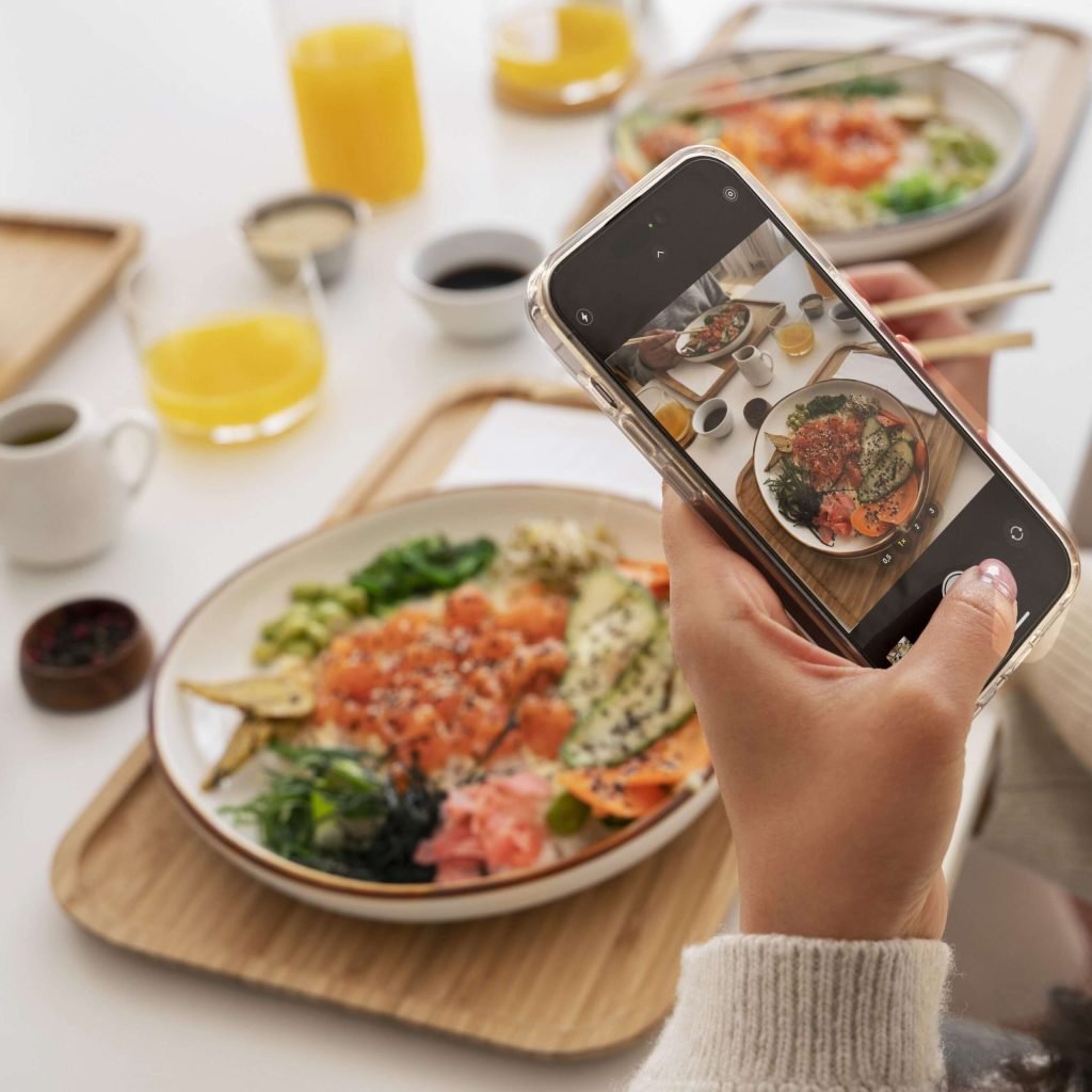 person-taking-photo-seafood-dish-with-salmon